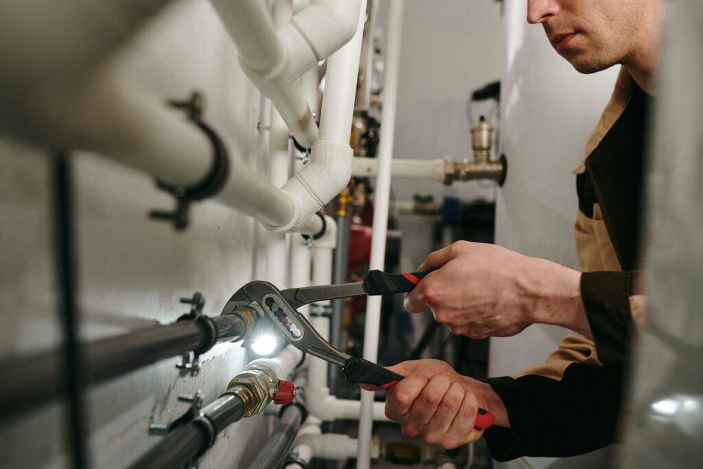 Plumbers maintaining commercial plumbing pipes in Winter Springs