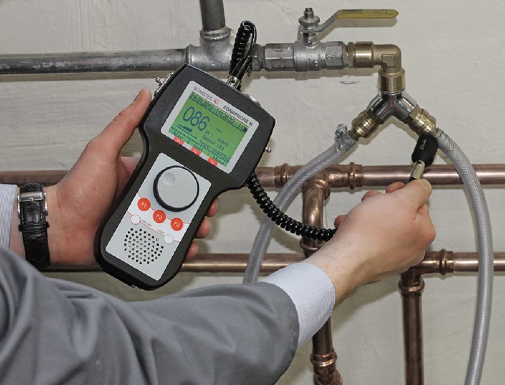 Plumber testing pipes with electronic leak detection equipment in Winter Springs
